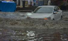 Heavy rains lashed Hyderabad on Monday bringing down temperatures and a respite from the heat. The late evening showers brought life to a standstill, inundated roads making it impossible for commuters to travel smoothly. - Sakshi Post