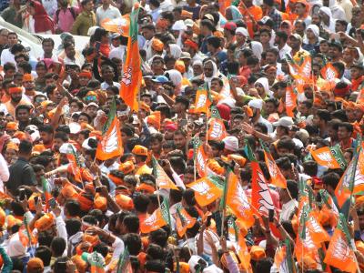 Prime Minister Narendra Modi greets the crowd during a road show as part of an election campaign  in Varanasi on Thursday. - Sakshi Post