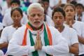 PM joins thousands in record-breaking yoga event at Rajpath - Sakshi Post