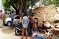 10 vehicles destroyed as wall collapses - Sakshi Post