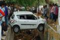 Sleepless man drives car onto nala, stuck in dangerous position - Sakshi Post