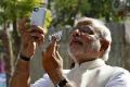 Modi taking a selfie at a polling booth after casting his vote i - Sakshi Post