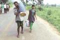 Dana Majhi walked 10 km distance carrying his wife’s body on his shoulder along with his 12-year old daughter. - Sakshi Post