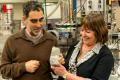 Professor Allen Nutman and Associate Professor Vickie Bennett holding a 3.7 billion year old rock containing stromatolite. Professor Allen Nutman and Associate Professor Vickie Bennett holding a 3.7 billion year old rock containing stromatolite. - Sakshi Post