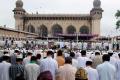 The devout offering prayers at Mecca Masjid near Charminar in Hyderabad on Tuesday. - Sakshi Post