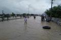 A submerged thoroughfare in Guntur. - Sakshi Post