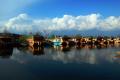 Houseboats grounded at the Dal Lake due to lack of tourists. - Sakshi Post