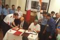 The Inter Governmental Agreement was signed by Defence Minister Manohar Parrikar and his visiting French counterpart Jean Yves Le Drian. The Inter Governmental Agreement was signed by Defence Minister Manohar Parrikar and his visiting French counterpart Jean Yves Le Drian. - Sakshi Post