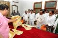 Telangana Chief Minister K Chandrashekhara Rao taking a glance at golden crown and ornaments to be presented to Goddess Bhadrakali in Warangal on Sunday. - Sakshi Post