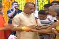 Governor Narasimhan, wife Vimala Narasimhan greet people at Raj Bhavan in Prajaa Darbaar on Sunday. - Sakshi Post