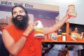 Baba Ramdev with Patanajali products Baba Ramdev with Patanajali products - Sakshi Post