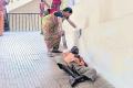 Patient Srinivasachary being dragged by wife to first floor for doctor consultation - Sakshi Post