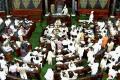 Slogan-shouting opposition members rushed into the well of the House, forcing Deputy Chairman P J Kurien to first adjourn the proceedings till 1130 hours and then again till noon - Sakshi Post