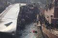 INS Betwa lying on its side after the mishap at the Naval dockyward, Mumbai - Sakshi Post