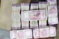 Unaccounted money of Rs 58 lakh in new Rs 2,000 notes was seized from their possession - Sakshi Post