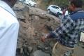 Crater created on the road by  Maoist landmine - Sakshi Post