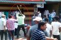 TDP MLA Amanchi Krishna Mohan’s brother Swamulu (green shirt) thrashing journalist Nagarjuna Reddy in Chirala on Sunday. - Sakshi Post