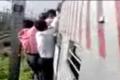 Few students were standing on the footboard of a train - Sakshi Post