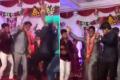 The groom can be seen dancing with his friends as wedding guests look on - Sakshi Post