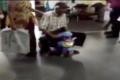 Accompanied by wife, Raju moves around on toy bike in Gandhi hospital on Friday - Sakshi Post