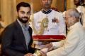 Virat Kohli receives Padma Shri award from President Pranab Mukherjee at a special function held at Rashtrapati Bhavan, on Thursday. - Sakshi Post