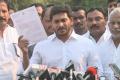 YS Jagan showing a copy of the memorandum submitted to Governor - Sakshi Post