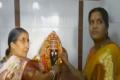 Jashodaben offering prayers in Nagadevatha temple Jashodaben offering prayers in Nagadevatha temple - Sakshi Post