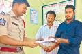 Ravi lodging a complaint with the police - Sakshi Post