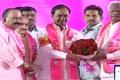 KCR being congratulated by Deputy Chief Ministers Kadiyam Srihari, Mahmood Ali, Home Minister Nayani Narsimha Reddy and other leaders after his election as president of TRS at the plenary on Friday. - Sakshi Post