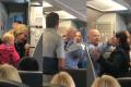 A passenger onboard the aircraft recorded the altercation in which the American Airlines employee is escorted - Sakshi Post