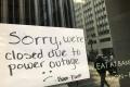 A sign on a restaurant informs customers that the facility is closed due to a power cut, in San Francisco - Sakshi Post