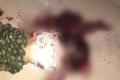 The body of Rajasekhara Reddy lying in a pool of blood near Kasturiba Model School in KCB Puram mandal on Saturday night. - Sakshi Post