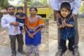Nihaal Prian with parents - Sakshi Post