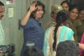 Charmme Kaur waving at fans while leaving Abkari Bhavan - Sakshi Post