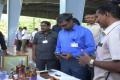 The officials produce 14 bullets and  a Walther pistol seized at the Alipiri check-post - Sakshi Post
