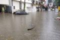 The rains wreaked havoc across the city, crippling normal life, flooding roads and houses in many localities - Sakshi Post