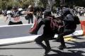 Joey Gibson being chased by anti-fascists - Sakshi Post