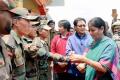 Nirmala Sitharaman tying rakhi to armed forces personnel (file photo) - Sakshi Post