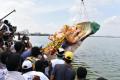 In a departure from the past, the 57-feet Khairatabad Ganesh idol was immersed in the Hussain Sagar lake on Tuesday afternoon, well before the end of the last day of Ganesh Chaturthi festivities. - Sakshi Post