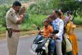 CI Shubh Kumar with folded hands in front of a motorist riding with four pillion riders has gone viral on Tuesday - Sakshi Post
