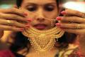 Hallmark mentions the carat of gold used in the ornaments - Sakshi Post