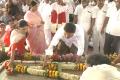 YS Jagan, along with mother Vijayamma and sister Sharmila, pays floral tribute to late Dr YS Rajasekhar Reddy at YSR Ghat in Idupulapaya before launching his PrajaSankalpaYatra on Monday. - Sakshi Post