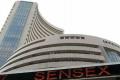 The Sensex touched a high of 33,094.30 points and a low of 32,987.58 points in the trade so far - Sakshi Post