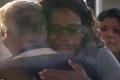 Donald’s manager hugs one of the victim’s relatives Donald’s manager hugs one of the victim’s relatives - Sakshi Post