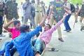 Students being arrested while staging a dharna on the Osmania University campus on Monday - Sakshi Post