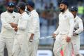 Indian players leave the field after the draw in the third Test against Sri Lanka at the Feroz Shah Kotla - Sakshi Post