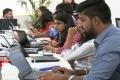 The H-1B program offers temporary US visas that allow companies to hire highly skilled foreign professionals working in areas with shortages of qualified American workers - Sakshi Post