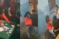 Video grab of the girl (orange shirt) being attacked by the student union leader. - Sakshi Post