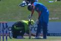 The picture showing a Pak fieldsman tying the shoelaces of an Indian Batsman went viral on social media - Sakshi Post