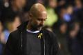 Guardiola wore a yellow ribbon during City’s shock FA Cup loss against Wigan on Monday. - Sakshi Post